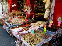 Chinatown hawker vendors managing leftover meals
