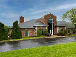 Family reading Carlton Gray Funeral Home obituaries online.

