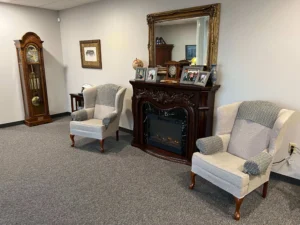 Family reading Berryhill Funeral Home obituaries together.