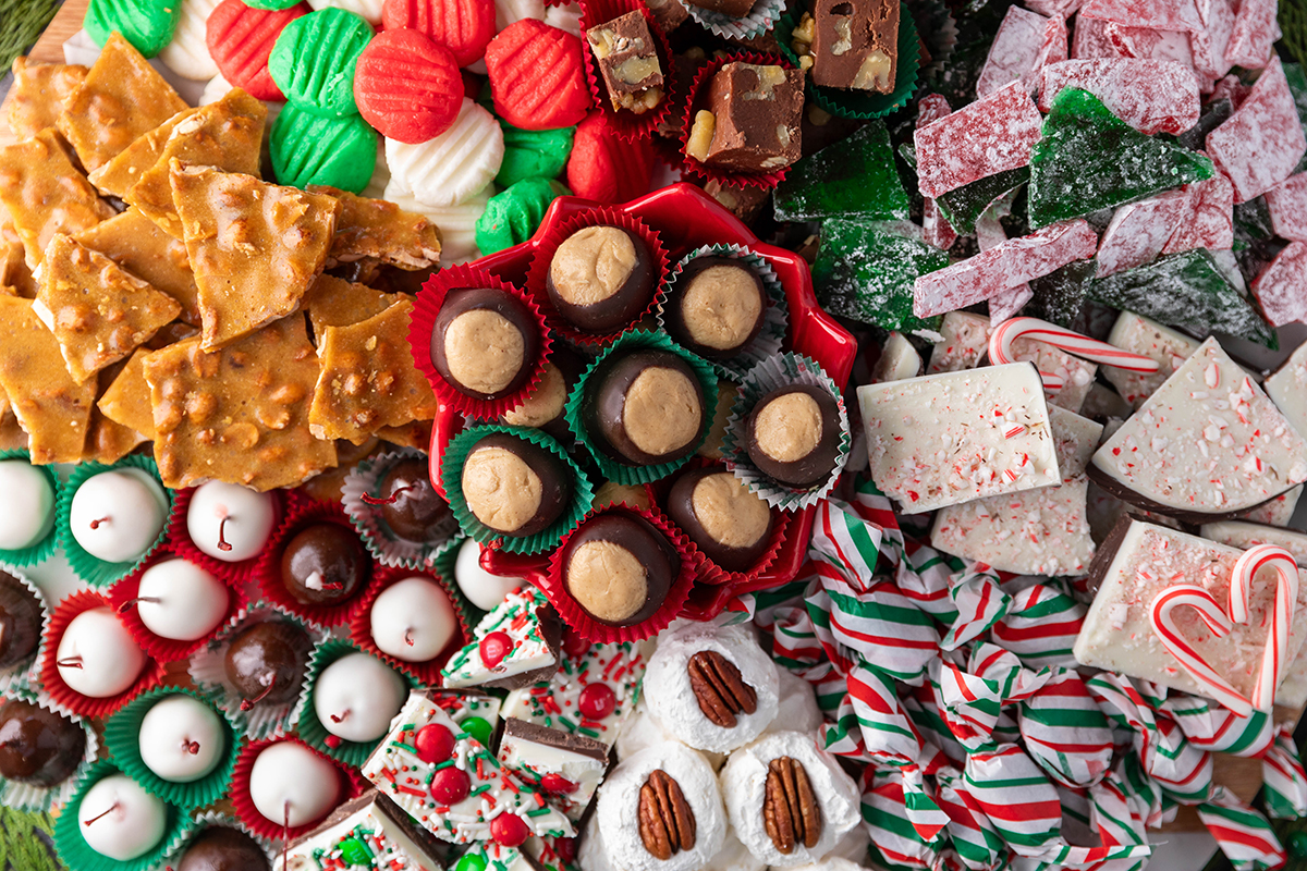 "Retro display of old-fashioned candy like taffy, hard candies, and chocolate bars."