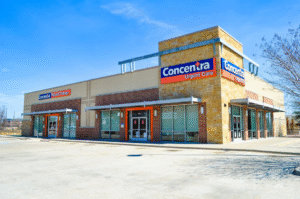 Exterior view of a Concentra Urgent Care clinic building during daytime